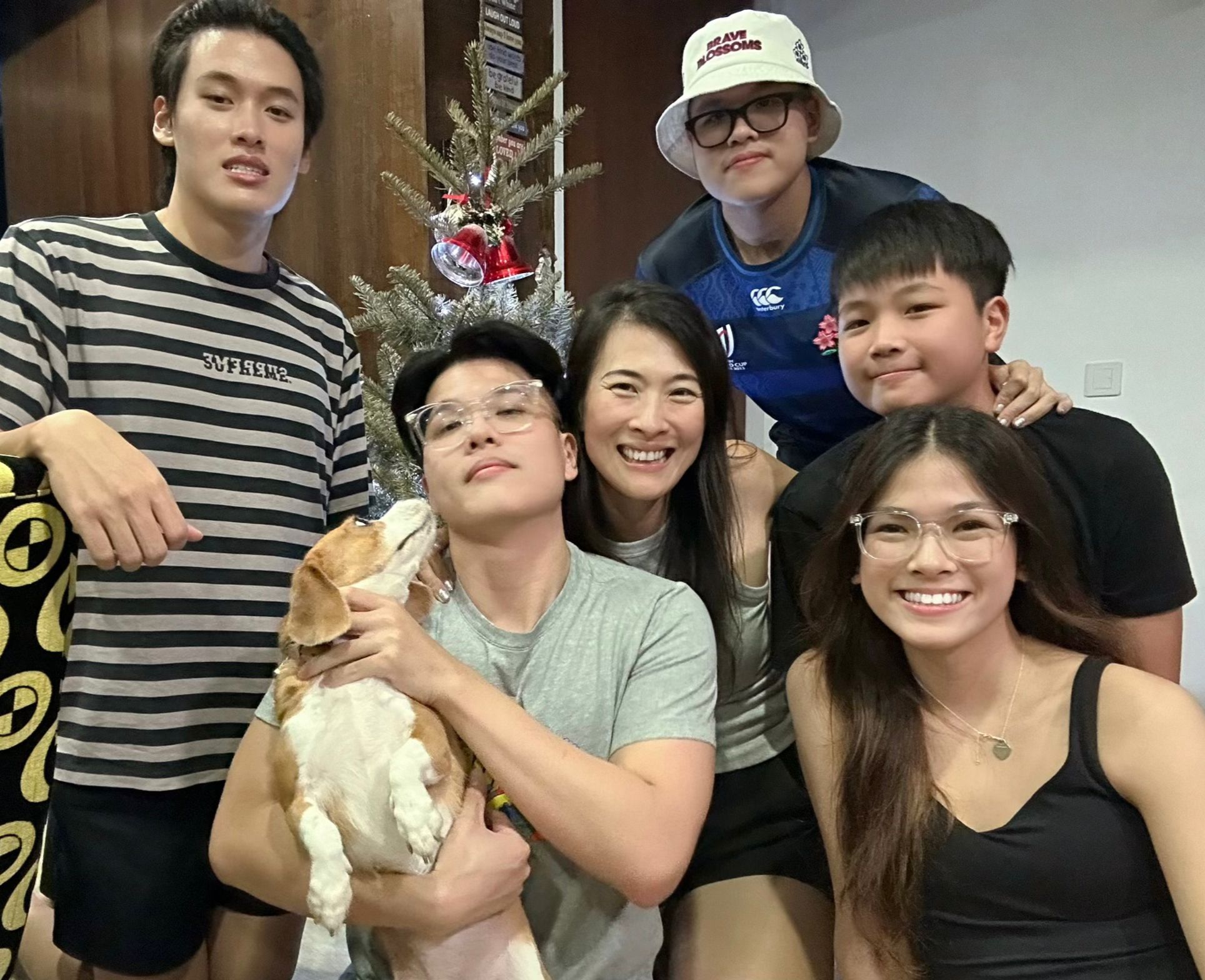 Teni Atmadja with her five children and the family dog